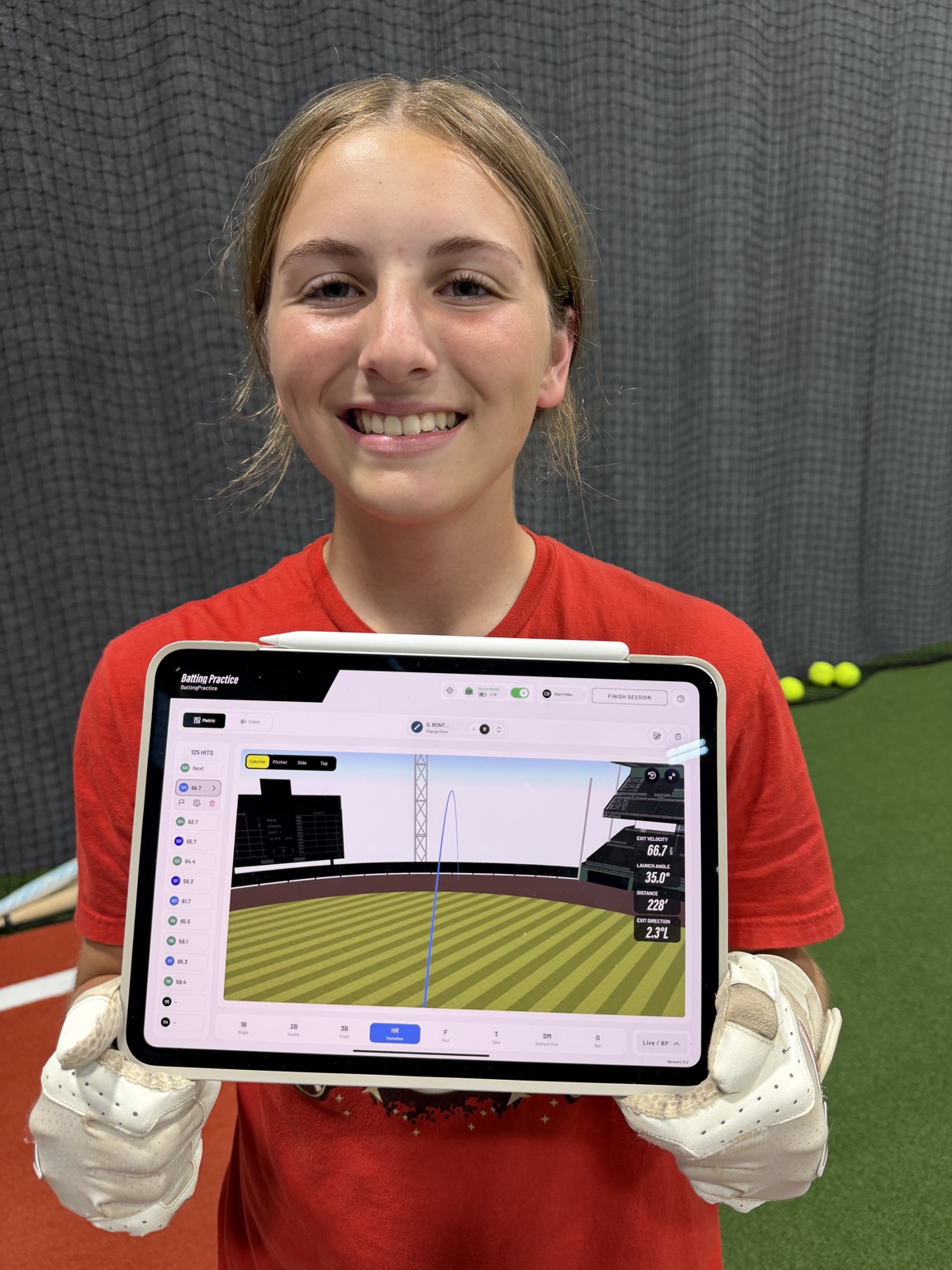 Softball hitter displaying Rapsodo hitting analytics
